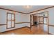 Inviting living room with hardwood floors, a fireplace, and shuttered windows for a comfortable living space at 5405 Friendship Patterson Mill Rd, Burlington, NC 27215