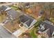 An aerial view of a single-Gathering home with a driveway, landscaping, and a backyard area with fencing at 610 Brownstone Rd, Gibsonville, NC 27249