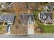Aerial view of the property showing its landscaped yard, and surrounding neighborhood at 610 Brownstone Rd, Gibsonville, NC 27249