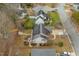 Overhead view of a home featuring a patio area with a dining set and solar panels installed on the roof at 610 Brownstone Rd, Gibsonville, NC 27249