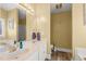 Bright bathroom with double vanity, framed mirrors and separate toilet room at 610 Brownstone Rd, Gibsonville, NC 27249