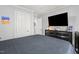 Neutral bedroom with a television and plenty of closet space at 610 Brownstone Rd, Gibsonville, NC 27249