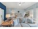 Bright bedroom featuring a cozy seating area, modern ceiling fan and en-suite bathroom at 610 Brownstone Rd, Gibsonville, NC 27249