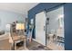 A flexible living space featuring a cozy lounge area, work space and an en-suite bathroom at 610 Brownstone Rd, Gibsonville, NC 27249