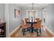 Cozy dining area with a round table, four chairs, and a window that provides natural light at 610 Brownstone Rd, Gibsonville, NC 27249
