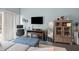 Relaxing living room with a large television, plush seating and an adjacent office area at 610 Brownstone Rd, Gibsonville, NC 27249
