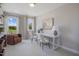 Bright home office with neutral tones, two windows, modern furniture, and decorative shelving at 6130 Arsenal Ave, Raleigh, NC 27610