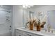 Bathroom featuring double vanity, large mirror, tub/shower combo, and stylish decor at 627 Contento Ct, Sanford, NC 27330