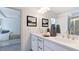Bathroom showcasing double vanity with elegant fixtures and a view to bedroom and shower at 627 Contento Ct, Sanford, NC 27330