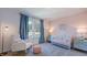 Charming Bedroom with rocking chair, crib, and patterned accent wall at 627 Contento Ct, Sanford, NC 27330