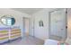 Bedroom featuring changing table with decorative accents and an open doorway to the closet at 627 Contento Ct, Sanford, NC 27330
