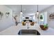 Modern kitchen with an open layout, stainless steel appliances, and bright lighting at 627 Contento Ct, Sanford, NC 27330