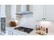 Bright kitchen featuring stainless steel appliances, stone countertops, and stylish backsplash at 627 Contento Ct, Sanford, NC 27330