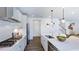 Modern kitchen with stainless steel appliances, a quartz countertop, and a stylish backsplash at 627 Contento Ct, Sanford, NC 27330