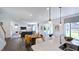 Open-concept living room with modern finishes and a view of the dining area and kitchen at 627 Contento Ct, Sanford, NC 27330