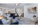 Open-concept living room with modern furnishings, bright lighting, and beautiful decor throughout at 627 Contento Ct, Sanford, NC 27330