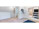 Open loft space with a view of the fitness area, equipped with a workout station, and a view of the lower level at 627 Contento Ct, Sanford, NC 27330