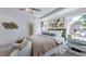Tranquil main bedroom with tray ceilings, a large bed, and bright windows at 627 Contento Ct, Sanford, NC 27330