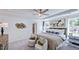 Relaxing main bedroom with soft lighting, neutral decor, and a glimpse into the ensuite bathroom at 627 Contento Ct, Sanford, NC 27330