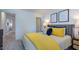 Bright main bedroom with stylish decor, including elegant artwork and a coordinated color scheme at 627 Contento Ct, Sanford, NC 27330