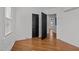Spacious bedroom featuring contrasting doors and neutral tones at 704 Dothan Ave, Burlington, NC 27217