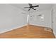 Bright bedroom with wood floors, light walls, a ceiling fan, and natural light at 704 Dothan Ave, Burlington, NC 27217