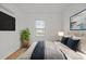 Cozy bedroom with a comfortable bed, neutral tones, and a window for natural light at 704 Dothan Ave, Burlington, NC 27217