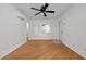 Bedroom with hardwood floors, light walls, a ceiling fan, and natural light at 704 Dothan Ave, Burlington, NC 27217
