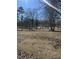 A spacious park featuring mature trees and a play area is ready for outdoor enjoyment at 704 Dothan Ave, Burlington, NC 27217