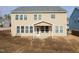 A view of the back of the home featuring a covered patio and many windows at 800 Tree Green Ln, Wake Forest, NC 27587