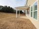 Exterior view of a home's patio and spacious backyard, perfect for outdoor entertaining and relaxation at 800 Tree Green Ln, Wake Forest, NC 27587