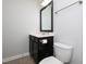 Cozy bathroom featuring a vanity with a sink, mirror, and a toilet at 800 Tree Green Ln, Wake Forest, NC 27587