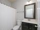 Bright bathroom with vanity, toilet, and shower with a white curtain for privacy at 800 Tree Green Ln, Wake Forest, NC 27587
