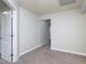 Spacious carpeted bedroom with a neutral paint and an open doorway to another room at 800 Tree Green Ln, Wake Forest, NC 27587