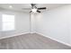 Bright bedroom featuring neutral walls, ceiling fan, and a window at 800 Tree Green Ln, Wake Forest, NC 27587