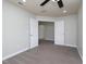 Bright bedroom with double doors to another room, neutral carpet and ceiling fan at 800 Tree Green Ln, Wake Forest, NC 27587