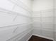 Walk-in closet with multiple white wire shelves for ample storage space at 800 Tree Green Ln, Wake Forest, NC 27587