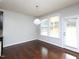 Dining area with hardwood floors, large windows, and a modern chandelier at 800 Tree Green Ln, Wake Forest, NC 27587