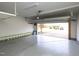 Open garage door reveals a well-maintained driveway and landscaping, blending indoor and outdoor living at 800 Tree Green Ln, Wake Forest, NC 27587