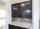 Kitchen features dark cabinets, mosaic backsplash, and granite countertops at 800 Tree Green Ln, Wake Forest, NC 27587