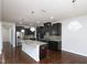 Well-equipped kitchen with a granite island, stainless steel appliances, and modern lighting at 800 Tree Green Ln, Wake Forest, NC 27587