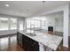 Stylish kitchen with a granite-topped island, stainless steel appliances, and hardwood floors at 800 Tree Green Ln, Wake Forest, NC 27587