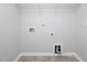 Functional laundry room with tile flooring, hookups, and shelving offers convenience and practicality at 800 Tree Green Ln, Wake Forest, NC 27587