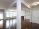 Open-concept living area with fireplace, built-in shelves, and hardwood floors at 800 Tree Green Ln, Wake Forest, NC 27587