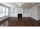 Spacious living room featuring a fireplace, hardwood floors, and built-in shelving at 800 Tree Green Ln, Wake Forest, NC 27587