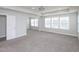 Large carpeted main bedroom features large windows providing ample natural light at 800 Tree Green Ln, Wake Forest, NC 27587