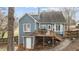 Exterior back view highlighting a deck, patio, and neutral colored siding at 886 Drogheda Pl, Wake Forest, NC 27587