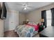 Well-lit bedroom with a ceiling fan, carpet, dresser, nightstand and full-sized bed at 886 Drogheda Pl, Wake Forest, NC 27587