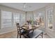 Sunlit breakfast nook features large windows and seating for six at 886 Drogheda Pl, Wake Forest, NC 27587