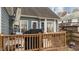 Wooden deck with grill and umbrella at 886 Drogheda Pl, Wake Forest, NC 27587